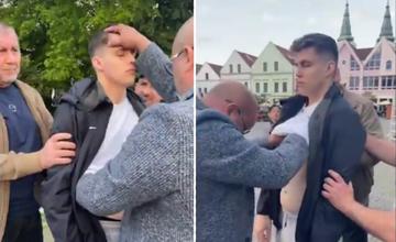 VIDEO: Šarlatán na žilinskom námestí „odstraňoval“ z ľudí očkovanie priložením rúk. Tí ďakovali Ježišovi